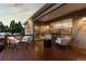 Charming outdoor patio with wicker chairs and string lights, perfect for relaxing in the evening at 5653 Yank St, Arvada, CO 80002
