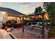 The backyard patio features a gazebo with string lights, creating a cozy outdoor space at 5653 Yank St, Arvada, CO 80002