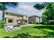 Expansive backyard with pergola-covered patio, lush lawn, and well-maintained landscaping, perfect for outdoor enjoyment at 531 Saber Creek Dr, Monument, CO 80132