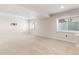 Large basement offers natural light, neutral carpet, and recessed lighting, perfect for customization at 531 Saber Creek Dr, Monument, CO 80132