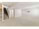 Spacious finished basement with neutral carpet, recessed lighting, and stairs leading to the upper level at 531 Saber Creek Dr, Monument, CO 80132