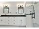 Modern bathroom features dual sinks, granite countertops and a glass enclosed shower at 531 Saber Creek Dr, Monument, CO 80132