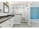Renovated bathroom featuring a glass shower, vanity, and modern finishes at 531 Saber Creek Dr, Monument, CO 80132