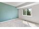 Comfortable bedroom with a large window and light green wall at 531 Saber Creek Dr, Monument, CO 80132