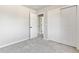 This bedroom is bright and neutral with a large closet and an adjacent bathroom through the doorway at 531 Saber Creek Dr, Monument, CO 80132