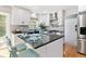 Stylish kitchen features white cabinets, modern countertops, stainless appliances, and a functional island at 531 Saber Creek Dr, Monument, CO 80132