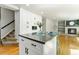 Open kitchen island flows into the living space, featuring modern finishes and stainless steel appliances at 531 Saber Creek Dr, Monument, CO 80132