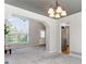 Bright, open living area features tall window, light gray walls, and flow into the kitchen at 531 Saber Creek Dr, Monument, CO 80132