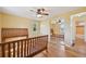 Bedroom features hardwood floors and a mirrored closet at 6819 Reno Dr, Arvada, CO 80002