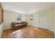 Inviting living room filled with natural light, featuring hardwood floors and a comfortable couch at 6819 Reno Dr, Arvada, CO 80002
