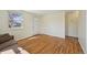 Comfortable living room with hardwood floors, natural light, and a welcoming front door at 6819 Reno Dr, Arvada, CO 80002