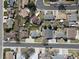 Wide aerial shot of a neighborhood street displaying the property and its surrounding homes at 6844 W 69Th Pl, Arvada, CO 80003