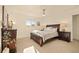 Serene bedroom with ample natural light, neutral decor, and classic furniture at 6844 W 69Th Pl, Arvada, CO 80003