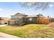 Charming two-story home with stone accents and a well-maintained front yard at 6844 W 69Th Pl, Arvada, CO 80003