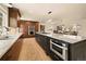Spacious kitchen boasts stainless steel appliances, ample storage, and an open layout at 6844 W 69Th Pl, Arvada, CO 80003