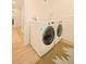 Well-equipped laundry room with modern washer and dryer units at 6844 W 69Th Pl, Arvada, CO 80003