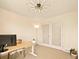 Bright home office with statement lighting and light hardwood floors at 6844 W 69Th Pl, Arvada, CO 80003