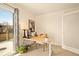 Bright home office with sliding glass doors that lead to an outdoor deck at 6844 W 69Th Pl, Arvada, CO 80003