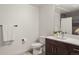 Clean bathroom with a dark vanity, sleek sink, modern mirror, and a shower with a neutral-toned curtain at 1898 S Bannock St # 510, Denver, CO 80223