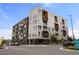 Modern multi-story apartment building featuring contemporary architecture, balconies, and well-maintained landscaping at 1898 S Bannock St # 510, Denver, CO 80223