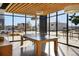 Bright game room featuring a ping pong table, modern light fixtures, and large windows with city views at 1898 S Bannock St # 510, Denver, CO 80223
