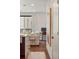 Open-concept living area with hardwood floors, a comfortable sofa, and a view of the balcony at 1898 S Bannock St # 510, Denver, CO 80223