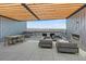 Rooftop deck featuring dining and lounge area with fireplace and panoramic mountain views at 1898 S Bannock St # 510, Denver, CO 80223