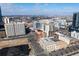 Wide city view featuring neighborhood rooftops and a skyline under a bright, partly cloudy sky at 2000 Arapahoe St # 1, Denver, CO 80205