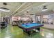 Spacious game room with a pool table, bar, and seating, perfect for entertaining at 2000 Arapahoe St # 1, Denver, CO 80205