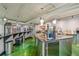 The kitchen offers a full size refrigerator, bar seating, and stainless steel countertop at 2000 Arapahoe St # 1, Denver, CO 80205