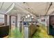 The kitchen offers a full size refrigerator, bar seating, and stainless steel countertop at 2000 Arapahoe St # 1, Denver, CO 80205