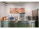 The kitchenette features stainless steel appliances and modern fixtures, perfect for quick meals and snacks at 2000 Arapahoe St # 1, Denver, CO 80205