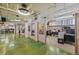 Open office space with concrete floors, multiple work stations, and exposed ductwork at 2000 Arapahoe St # 1, Denver, CO 80205