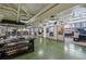 Wide angle view of office space with exposed ductwork, concrete floor, natural light, and individual work areas at 2000 Arapahoe St # 1, Denver, CO 80205