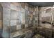 Modern steam shower featuring tiled walls, seating, and a contemporary shower head at 2000 Arapahoe St # 1, Denver, CO 80205