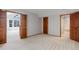 Spacious bedroom with plush carpeting and doorways to two other rooms, including a bathroom at 3951 S Carson St # D, Aurora, CO 80014