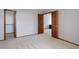 Bedroom includes plush carpeting, light walls, and closet at 3951 S Carson St # D, Aurora, CO 80014