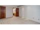 Spacious bedroom with neutral carpet, two closets, and bathroom access at 3951 S Carson St # D, Aurora, CO 80014