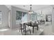 Elegant dining area featuring a table set for six and a large mirrored wall at 3951 S Carson St # D, Aurora, CO 80014