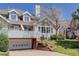 Charming townhome with two-car garage, brick accents, and landscaped front yard at 3951 S Carson St # D, Aurora, CO 80014