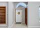 Welcoming foyer with tile flooring, coat closet, and transom window above the front door at 3951 S Carson St # D, Aurora, CO 80014