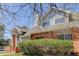 Charming two-story home featuring brick accents, landscaped yard and light blue siding at 3951 S Carson St # D, Aurora, CO 80014