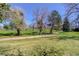 Expansive view of community green space with mature trees and lush, open lawn at 3951 S Carson St # D, Aurora, CO 80014
