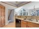 Kitchen with granite countertops and direct view into living room and staircase at 3951 S Carson St # D, Aurora, CO 80014
