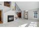 Open-concept living room featuring fireplace, staircase to 2nd level, and neutral paint at 3951 S Carson St # D, Aurora, CO 80014