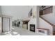 Spacious living room featuring fireplace, staircase to 2nd level, and neutral paint at 3951 S Carson St # D, Aurora, CO 80014