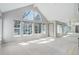 Bright and airy living room featuring large windows and an open-concept floor plan at 3951 S Carson St # D, Aurora, CO 80014