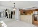 Open-concept floorplan with mirrors that reflect the kitchen and front entrance at 3951 S Carson St # D, Aurora, CO 80014