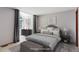 Stylish main bedroom featuring a cozy bed, window, and tasteful decor at 3951 S Carson St # D, Aurora, CO 80014