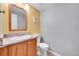 Stylish powder room with vanity, granite countertops, and neutral color scheme at 7077 S Knolls Way, Centennial, CO 80122